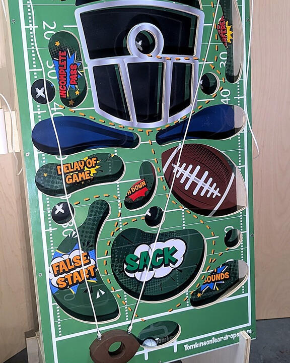 Get Vertical: Football board at an angle on its stand Get Vertical: Football board at an angle on its stand